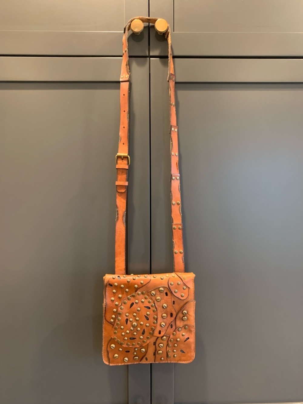Patricia Nash brown studded leather crossbody bag.